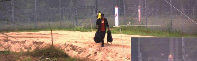 ФОТО | Провокация на границе Латвии и Беларуси: белорусские силовики помогли нелегалам пробраться через забор